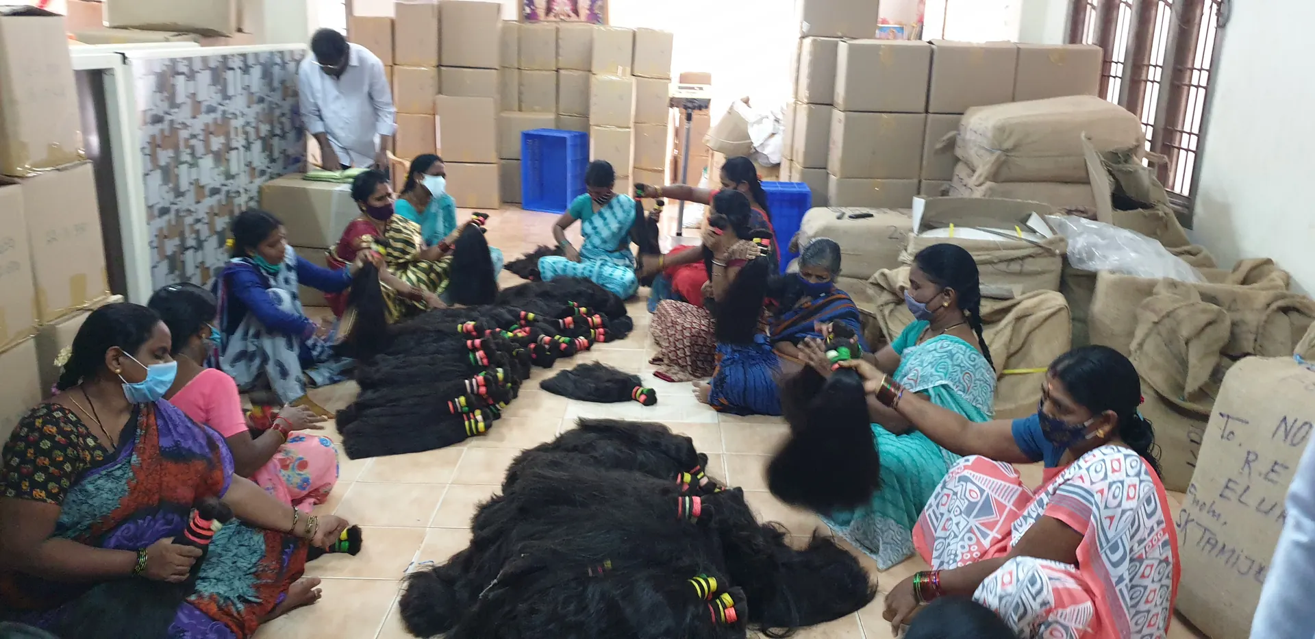 Ravi Group team hand-sorting human hair in the sorting hall