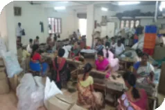 Large sorting hall at Ravi Group with staff sorting hair