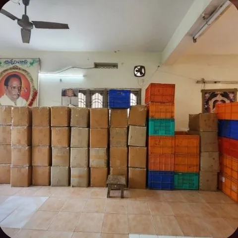 Cartons and crates stacked in storage